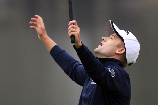 Russell Knox of Scotland celebrates on the 18th hole after the final round of the HSBC Champions golf tournament at the Sheshan International Golf Club in Sh