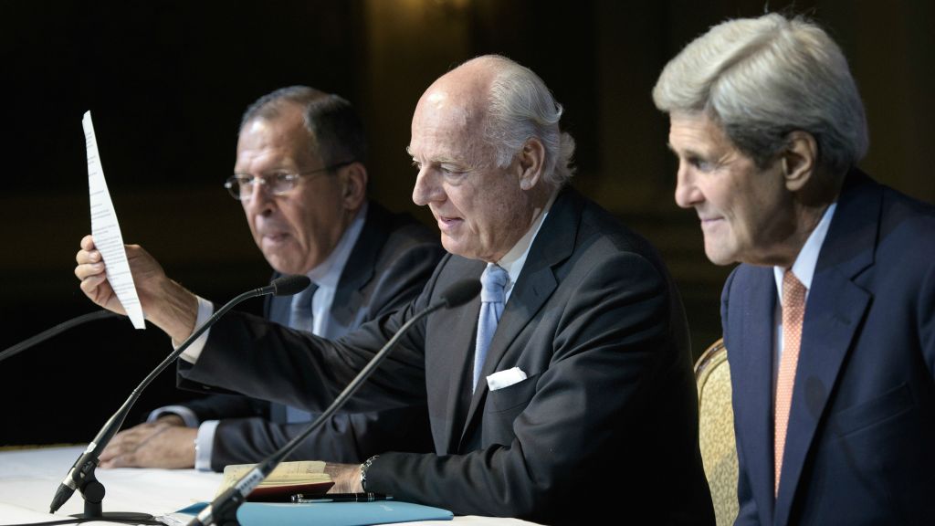 Russian Foreign Minister Sergei Lavrov left and Secretary of State John Kerry listen as UN Special Envoy for Syria Staffan de Mistura speaks during a news conference in Vienna Austria Friday