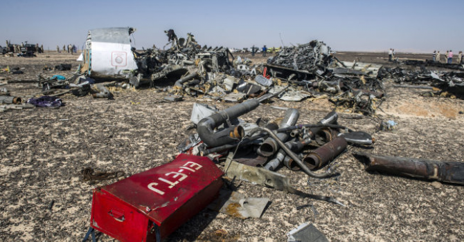 Debris belonging to Flight KGL 9268 a Russian airliner lie strewn across the desert at its crash site near Wadi al-Zolomat a mountainous area in Egypt's Sinai Peninsula on Nov. 1