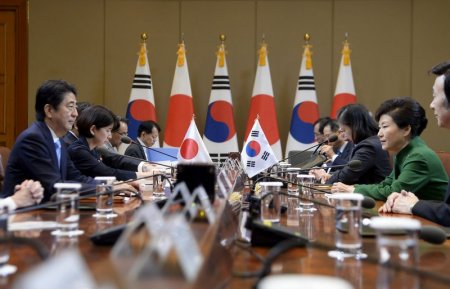 Japanese Prime Minister Shinzo Abe talks with South Korean President Park Geun Hye during their meeting at the presidential house in Seoul South Korea