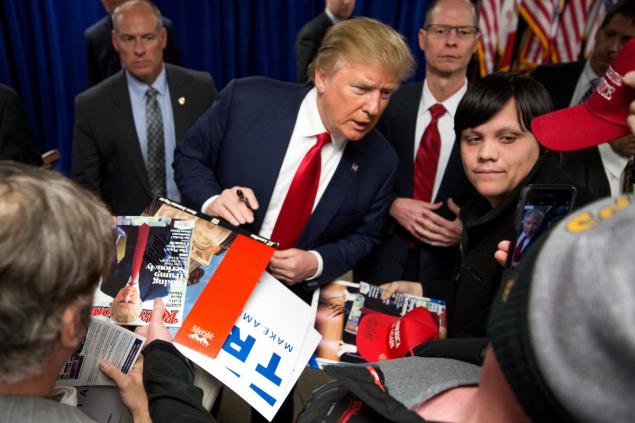 Donald Trump meets with supporters after a campaign rally in Newton Iowa on Thursday