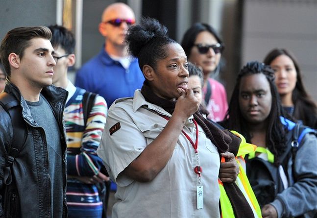 MUNI bus driver Cassandra Barnes reacts at the scene of a tour bus crash near Union Square in San Francisco Calif. on Friday Nov. 13 2015. According to The San Francisco Fire Department a double-decker tour bus crashed into multiple vehicles and pedes