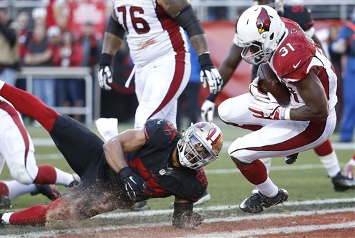 Arizona Cardinals running back David Johnson scores a touchdown run past San Francisco 49ers linebacker Michael Wilhoite during the second half of an NFL football game in Santa Clara Calif. Sunday Nov. 29 2015