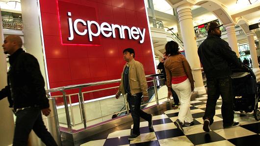 Shoppers pass a J.C. Penney store in New York