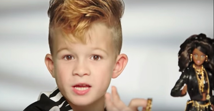 Screenshot of Moschino Barbie commercial featuring a boy