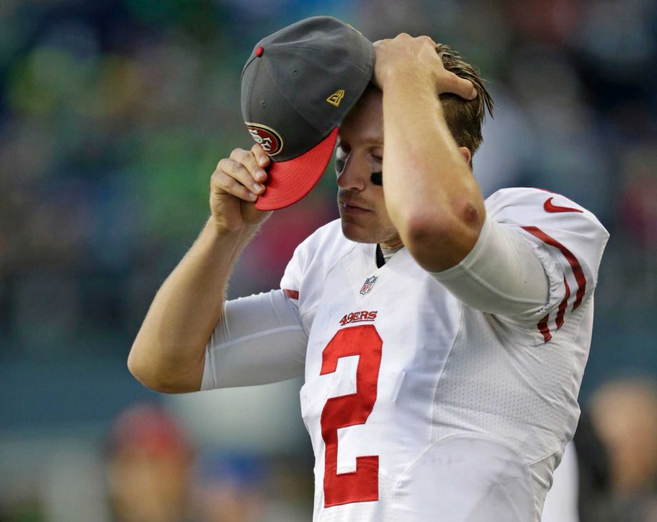 San Francisco 49ers quarterback Blaine Gabbert adjusts his cap on the sideline late in the second half of an NFL football game against the Seattle Seahawks Sunday Nov. 22 2015 in Seattle