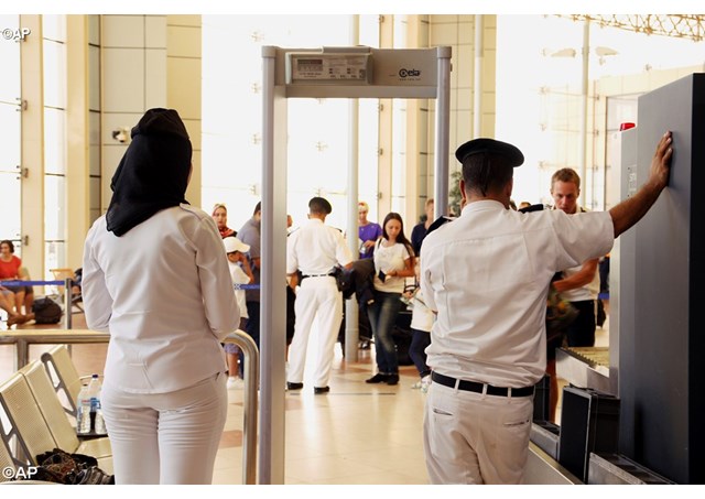 Security personnel wait to screen passengers departing Sharm el Sheikh International Airport in Egypt- AP