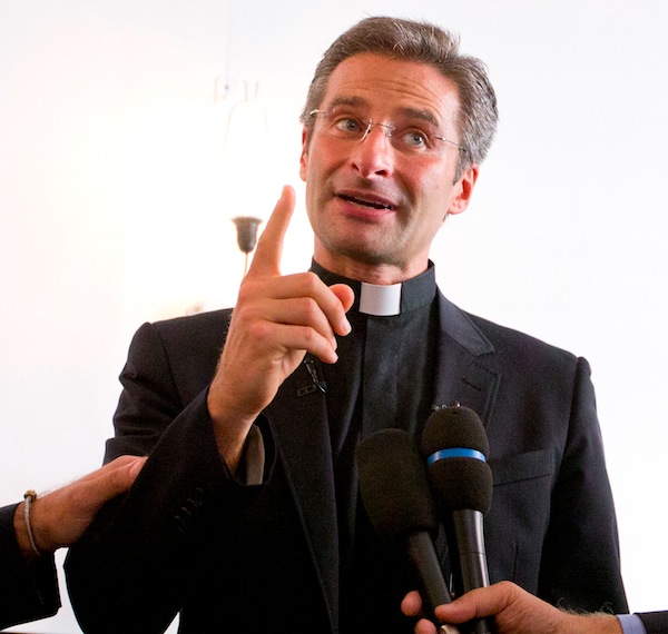 Monsignor Krzysztof Charamsa answers reporters questions during a news conference in downtown Rome Saturday Oct. 3 2015. The Vatican on Saturday fired Charamsa who came out as gay on the eve of a big meeting of the world's bishops to discuss church