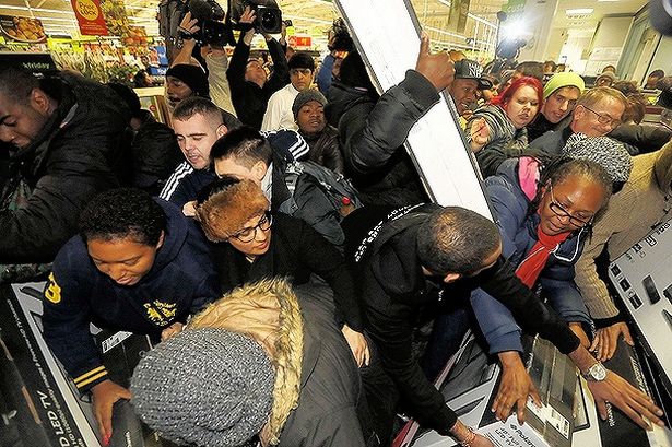 Shoppers join a scrum in London during Black Friday