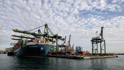 A container vessel docks at the Tanjong Pagar Terminal in Singapore