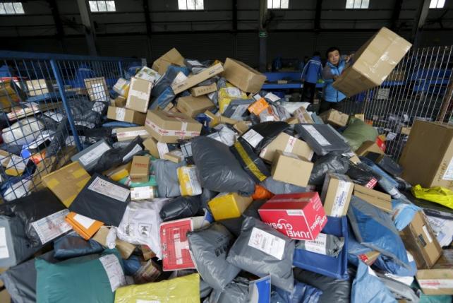 Employees work at a sorting centre of Zhongtong Express ahead of the Singles Day shopping festival Chaoyang District Beijing