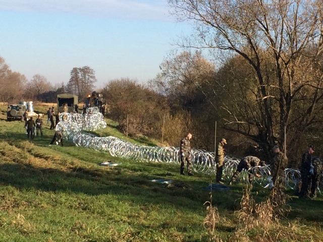 Slovenian military setting a barb wire fence in Veliki Obrez on the border with Croatia