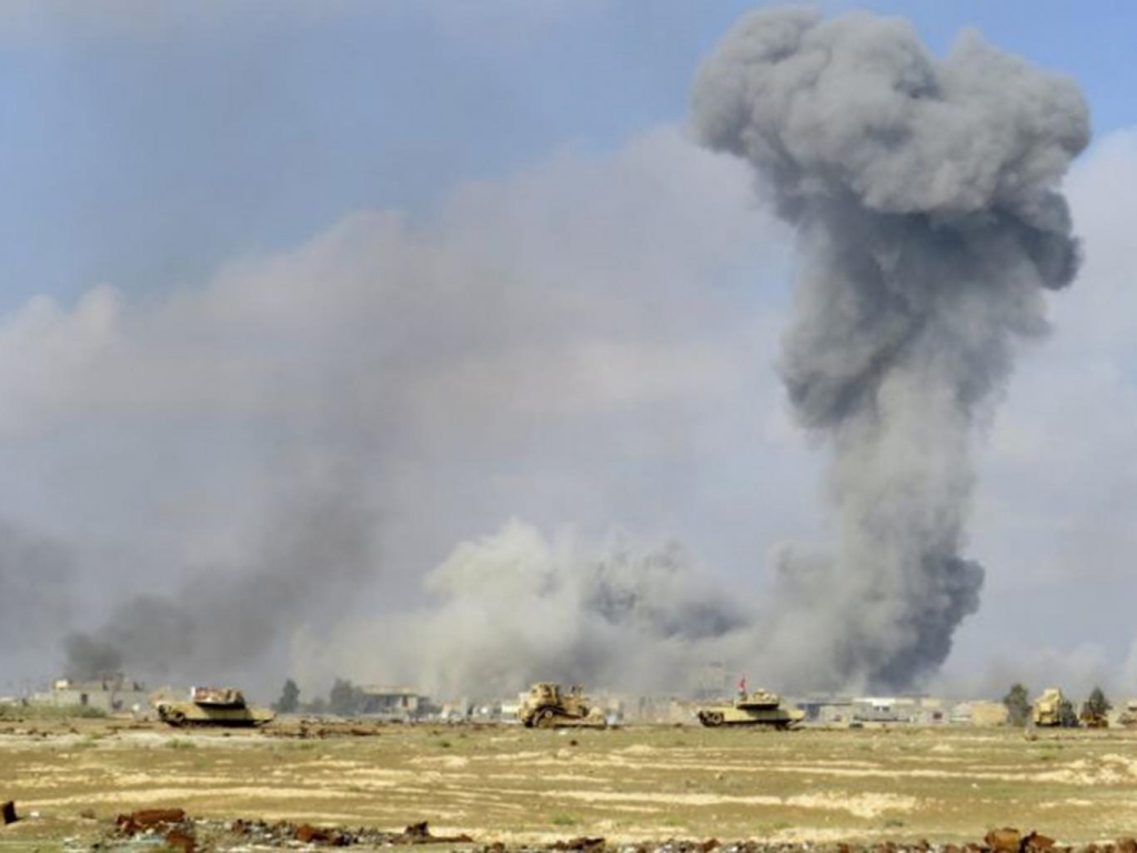 Smoke rises from Islamic State positions following a U.S.-led coalition airstrike Ap