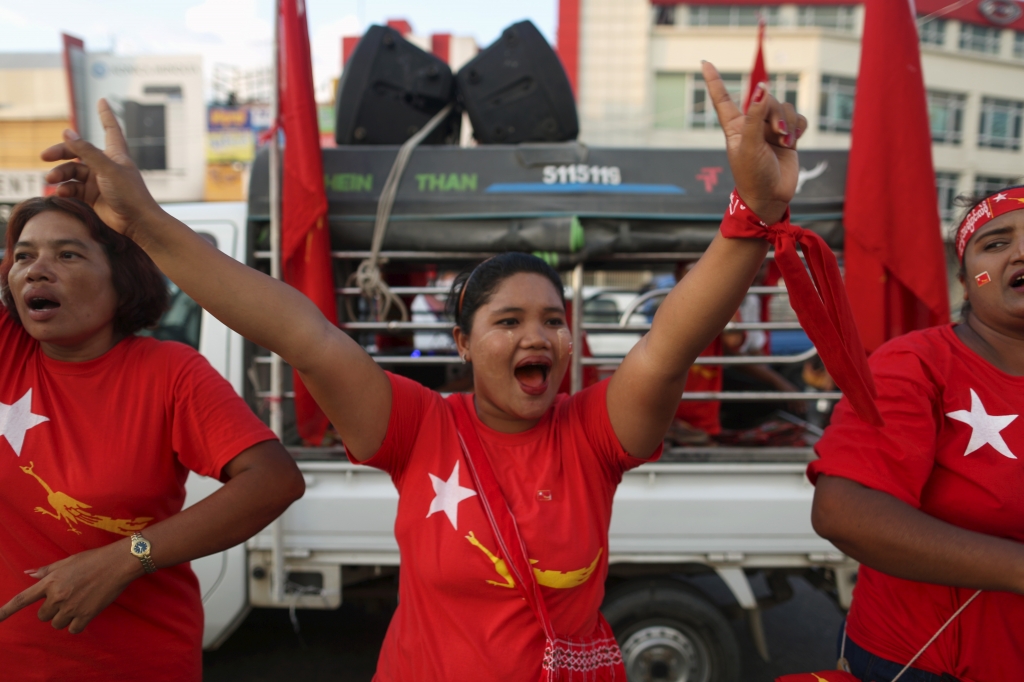 Supporters dance during a NLD party campaign rally in Yangon