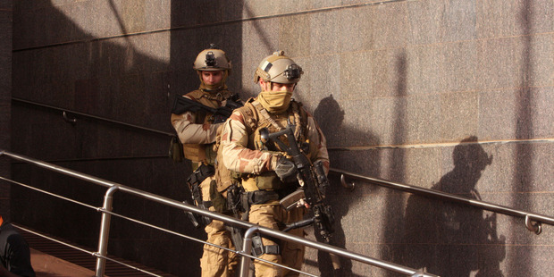 Soldiers leave the Radisson Blu hotel after assisting Mali soldiers during an attack by gunmen on the hotel in Bamako Mali