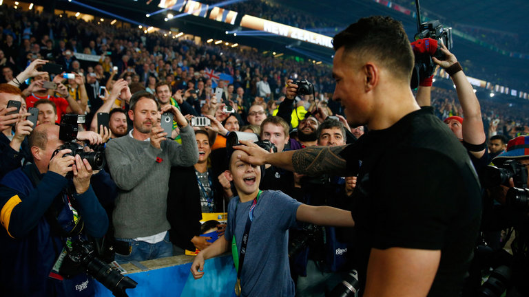 Sonny Bill Williams gives his winners medal to a young fan