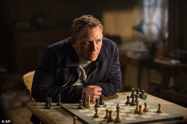 Daniel Craig appears above in a scene from the James Bond film Spectre. Spectre the 24th Bond installment and last week's top film took in $35.4million in its second weekend according to studio estimates on Sunday bringing its domestic total to $130