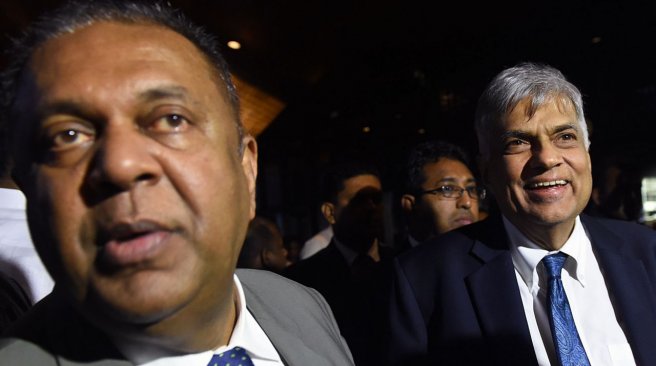 Sri Lankan Prime Minister Ranil Wickremasinghe and Foreign Minister Mangala Samaraweera arriveat the parliament after the 2016 budget was presented in Colombo