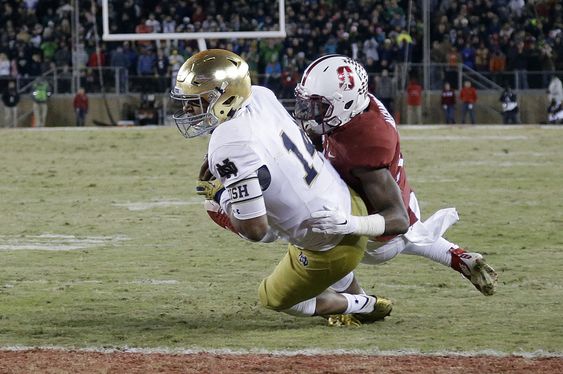 Shone Kizer lunges into the end zone past Stanford cornerback Terrence Alexander for a 2-yard touchdown run late in the fourth quarter of an NCAA college football game Saturday Nov. 28 2015 in Stanford Calif. Stanford won 38