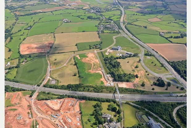 Still Imaging       
        Exeter Science Park centre right with excavations for the Tithebarn Lane development of new housing at Monkerton in the foreground