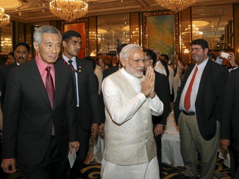 Prime Minister Narendra Modi gestures as he walks next to Singapore's Prime Minister Lee Hsein Loong after the Yusof Ishak Institutes 37th Singapore Lecture in Singapore