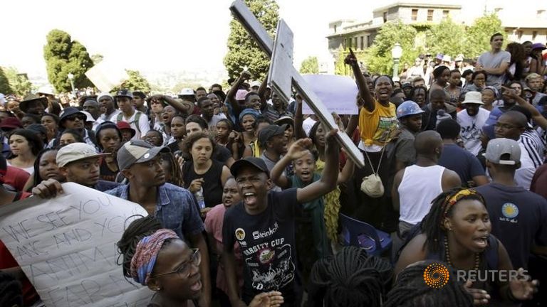 Students protest during a mass demonstration on the steps of Jameson Hall at the University of Cape Town