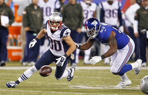 New England Patriots Danny Amendola and New York Giants Jasper Brinkley scramble for the ball fumbled by quarterback Tom Brady during the second half of an NFL football game Sunday Nov. 15 2015 in East Rutherford N.J. The Patriots recovered