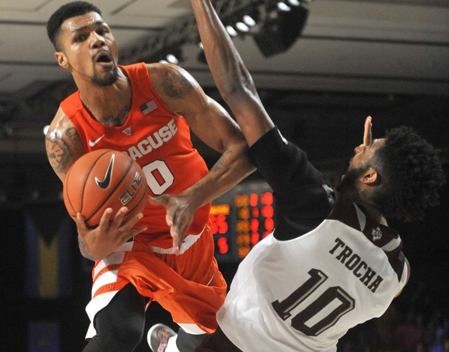 Syracuse’s Michael Gbinije drives to the basket against Texas A&M’s Tonny Trocha Morelos in the championship game of the Battle 4 Atlantis at Imperial Arena in Nassau Bahamas on Nov. 27 2015. Syracuse won 74-67 and Gbinije was named tournament MV