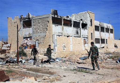 Syrian official news agency SANA shows Syrian government troops walk inside the Kweiras air base east of Aleppo Syria Wednesday Nov. 11 2015. Syrian government forces broke a siege imposed by the Islamic State group