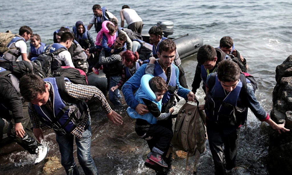 Syrian refugees come ashore on the Greek island of Lesbos in September 2015. AP