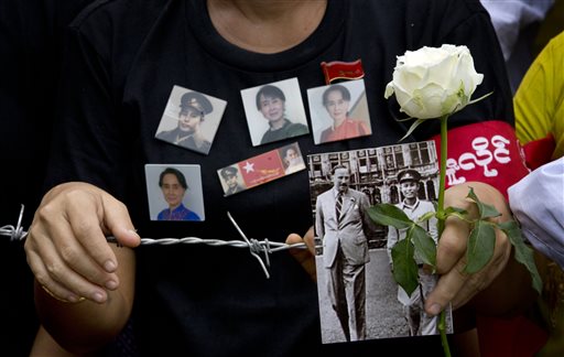 San and a white rose at a barricade leading to Martyrs&#039 Mausoleum to pay respect at the tomb of Myanmar's Independence hero and opposition leader Aung San Suu Kyi's father G