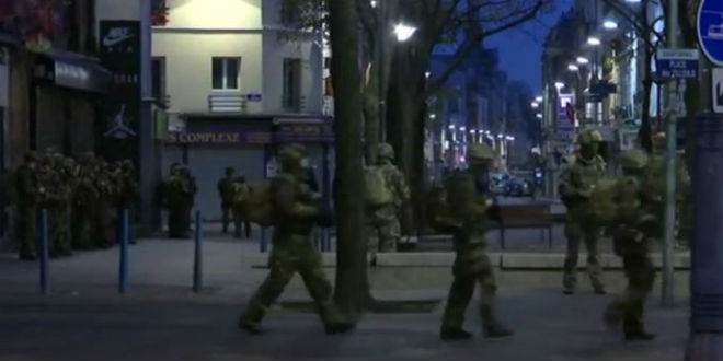 French soldiers seen in the Saint Denis neighborhood in Paris during a raid on the suspected mastermind of the Paris attacks