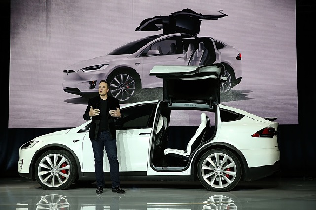 Tesla CEO Elon Musk speaks during an event to launch the new Tesla Model X Crossover SUV