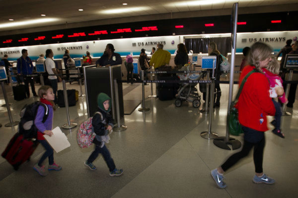 Thanksgiving holiday travelers at Philadelphia International Airport early Wednesday morning