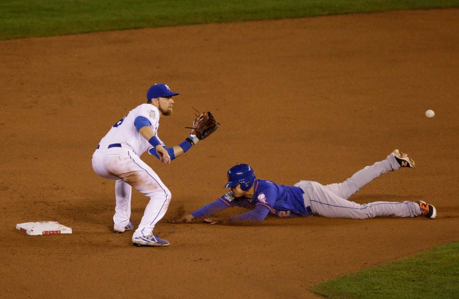 New York Mets Juan Lagares steals second base on a late throw to Kansas City Royals second baseman Ben Zobrist during the eighth inning of Game 1 of the Major League Baseball World Series Tuesday Oct. 27 2015 in Kansas City Mo