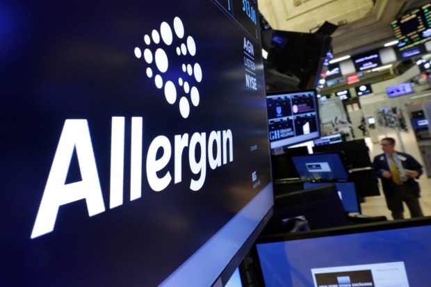 The Allergan logo appears above a trading post on the floor of the New York Stock Exchange on Monday