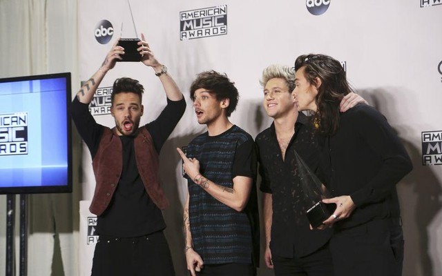 One Direction poses backstage with their awards for Favorite Rock  Pop Band  Duo  Group and Artist of the Year during the 2015 American Music Awards in Los Angeles California