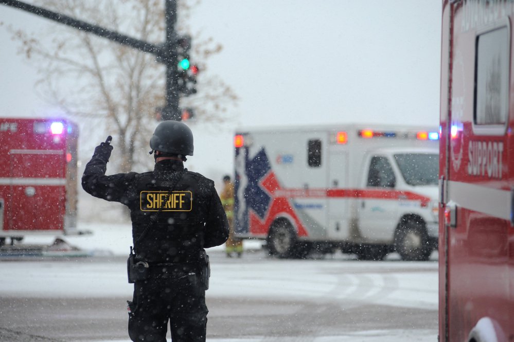 The Associated Press Police stand guard near a Planned Parenthood clinic Friday in Colorado Springs Colorado