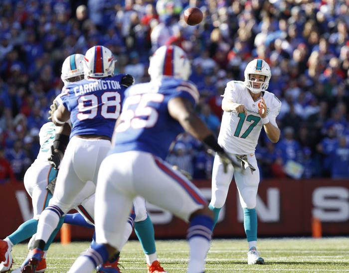 Nov 8 2015 Orchard Park NY USA Miami Dolphins quarterback Ryan Tannehill throws a pass under pressure by the Buffalo Bills defense during the first half at Ralph Wilson Stadium. Mandatory Credit Kevin Hoffman-USA TODAY Sports