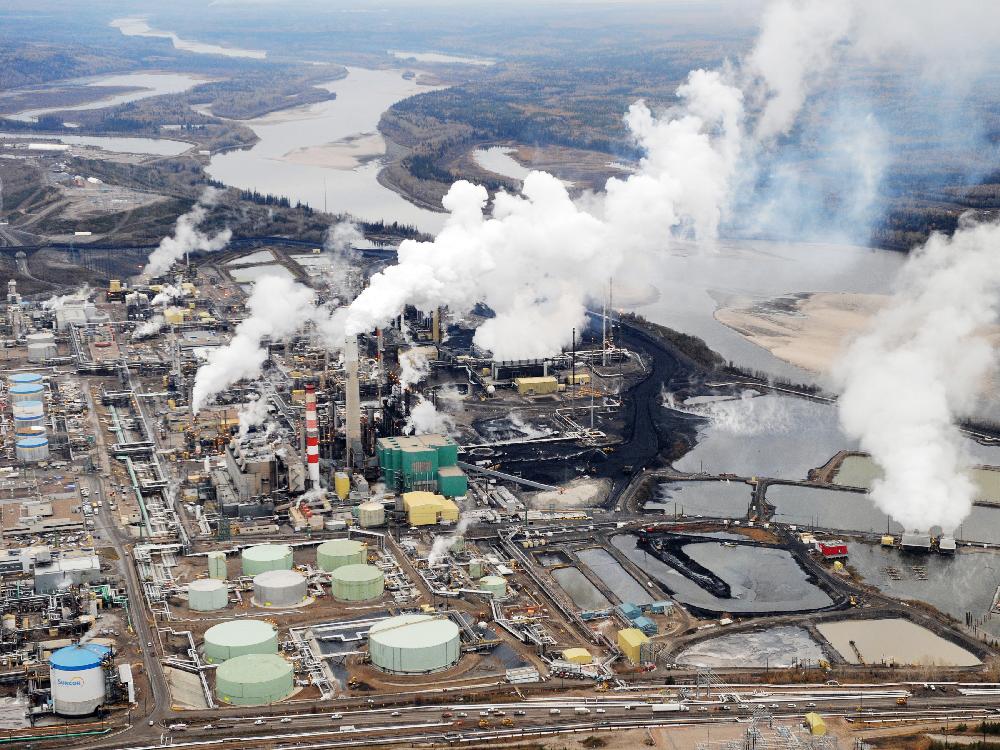 The aerial view shows the Suncor oilsands extraction facility near Fort McMurray Alta