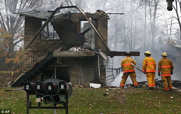 The charred remains of one of the houses that was hit by the plane. It is not known if anyone was inside at the time of the crash