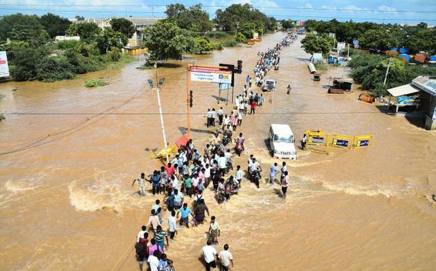 The submerged road leading to Tuticorin from FCI Godown at 3rd Mile in Tuticorin on Monday