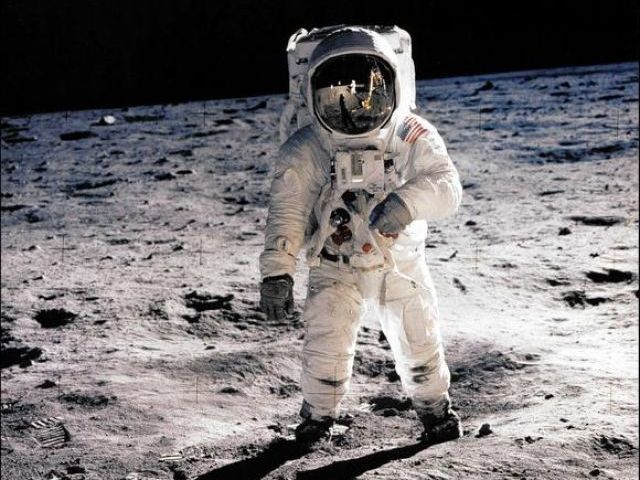 E Aldrin Jr walking on the surface of the moon