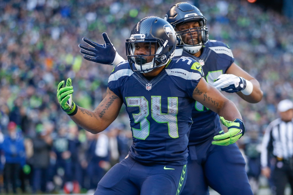 SEATTLE WA- NOVEMBER 22 Running back Thomas Rawls #34 of the Seattle Seahawks is congratulated by fullback Will Tukuafu #46 after scoring a touchdown in the first quarter against the San Francisco 49ers at Century Link Field