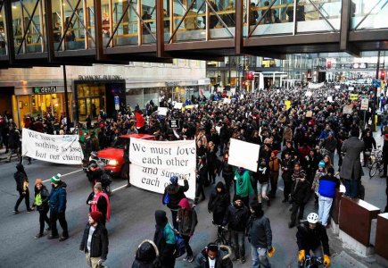 Members of the group Black Lives Matter march to city hall during a protest in Minneapolis Minnesota