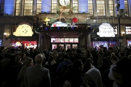 Shoppers wait to enter Macy's Herald Square store during the early opening of the Black Friday sales in the Manhattan borough of New York