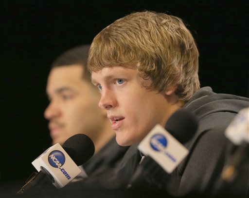 Wichita State's Ron Baker speaks at a news conference with teammate Fred VanVleet left before practice at the NCAA college basketball tournament Thursday