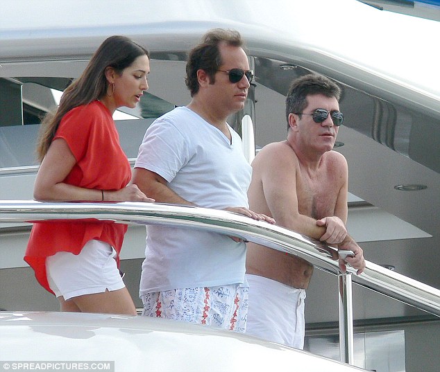 Three's a crowd Cowell with now partner Lauren and her then-husband Andrew Silverman on his yacht in 2012