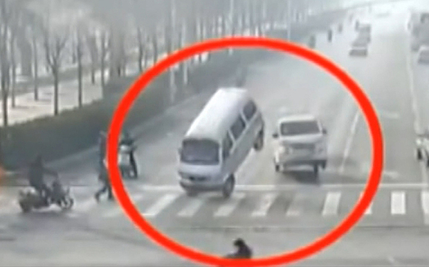 The bizarre moment three cars 'LEVITATE' in the road at a busy junction - but