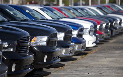 Ram pickup trucks are on display on the lot at Landmark Dodge Chrysler Jeep RAM in Morrow Ga. Fiat Chrysler sold almost 41,000 Rams in October 2015 the company reported Tuesday Nov. 3 2015 a 3 percent gain over